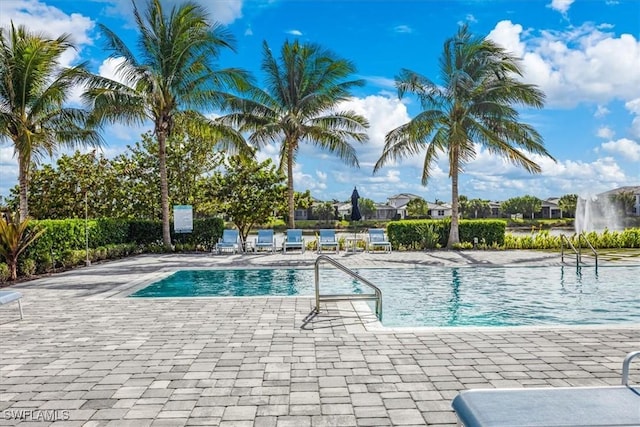 9088 Caicos Way, Naples, FL 34114 - community pool with a patio area