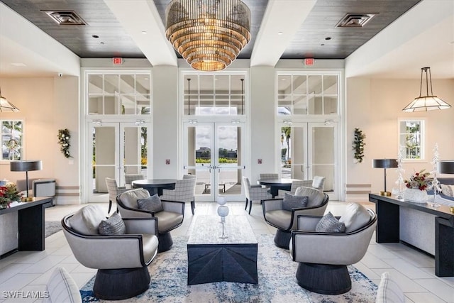 9088 Caicos Way, Naples, FL 34114 - community lobby with wooden ceiling, a high ceiling, and a surveillance system