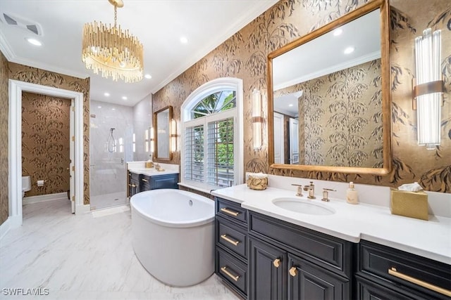 33 3rd St S, Naples, FL 34102 - full bathroom with wallpapered walls, a stall shower, crown molding, two vanities, and a soaking tub
