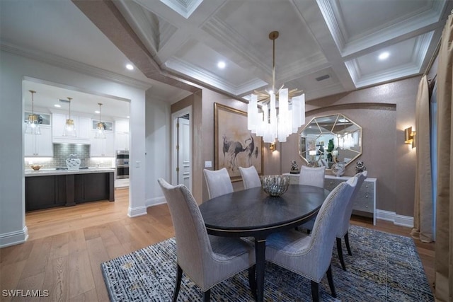 33 3rd St S, Naples, FL 34102 - dining space with a chandelier, coffered ceiling, crown molding, light wood-type flooring, and beamed ceiling