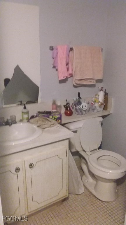 56 Brighton Unit B, Boca Raton, FL 33434 - bathroom with toilet and vanity