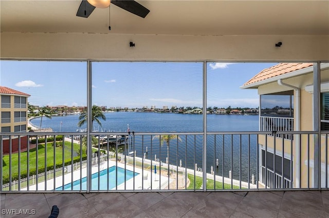 816 E Elkcam Cir Unit 305, Marco Island, FL 34145 - unfurnished sunroom featuring a water view