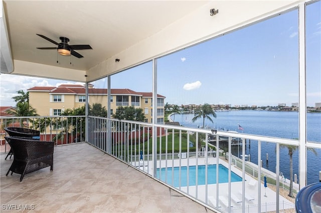 816 E Elkcam Cir Unit 305, Marco Island, FL 34145 - balcony with a water view, a ceiling fan, and view of pool