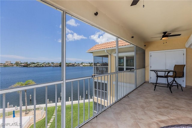 816 E Elkcam Cir Unit 305, Marco Island, FL 34145 - balcony featuring ceiling fan and a water view