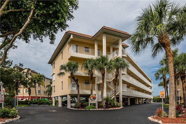 816 E Elkcam Cir Unit 305, Marco Island, FL 34145 - view of property featuring stairway