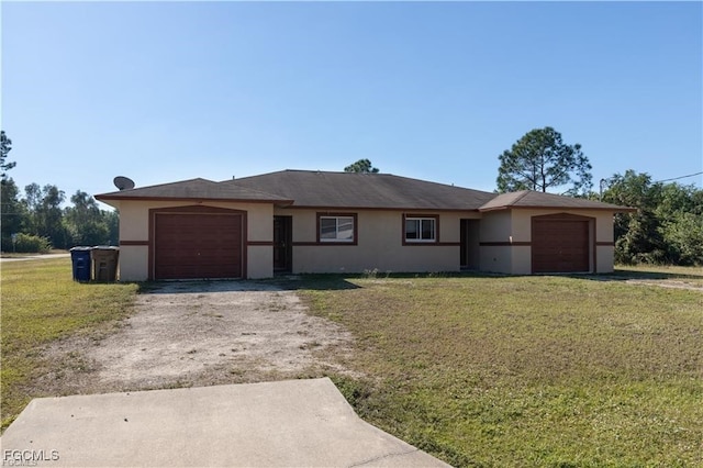 5201/5203 26th St SW, Lehigh Acres, FL 33973 - ranch-style home featuring a garage, stucco siding, a front lawn, and driveway