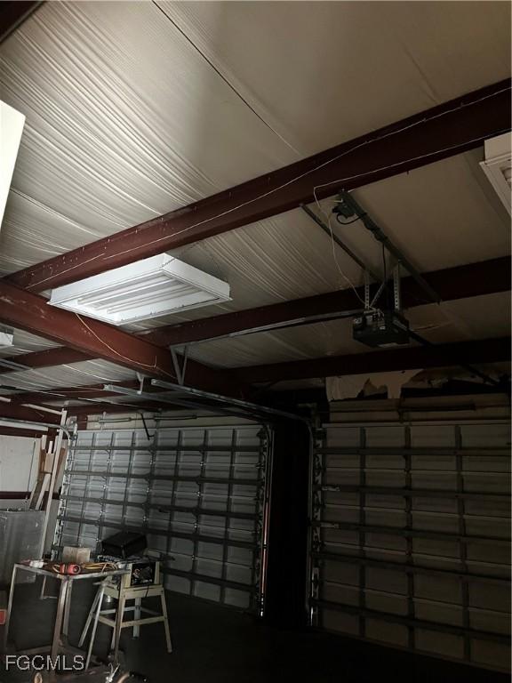 6292 Morgan La Fee Ln, Fort Myers, FL 33912 - garage featuring a garage door opener