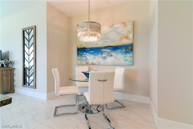 dining space featuring light tile flooring and a notable chandelier