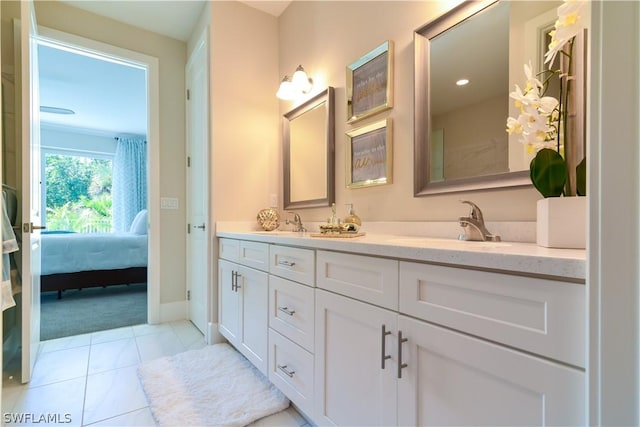 bathroom featuring tile floors, double sink, and oversized vanity