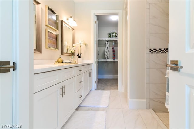 bathroom with tile floors and vanity