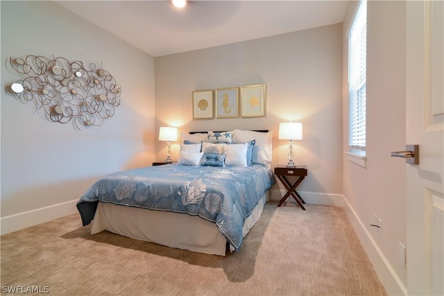 bedroom with light colored carpet