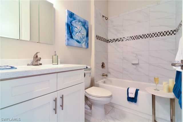 full bathroom with toilet, vanity with extensive cabinet space, tile flooring, and tiled shower / bath combo