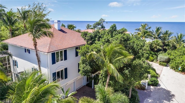 birds eye view of property with a water view