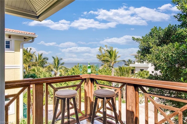 balcony featuring a water view