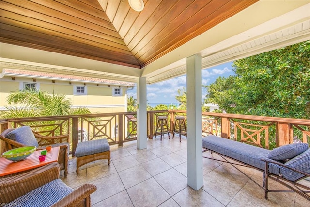 sunroom / solarium featuring wooden ceiling