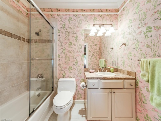 full bathroom with enclosed tub / shower combo, large vanity, and toilet