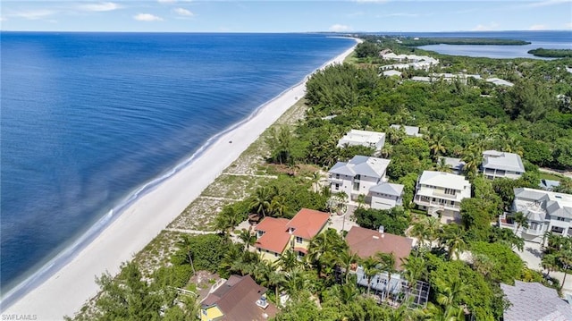 bird's eye view with a water view and a view of the beach