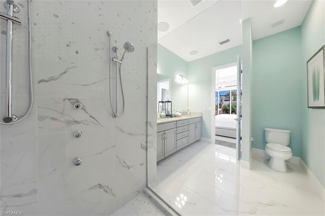 bathroom featuring vanity, tile flooring, toilet, and tiled shower