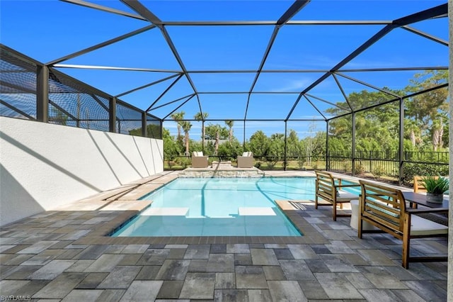 view of pool with a patio and a lanai