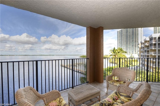 balcony featuring a water view