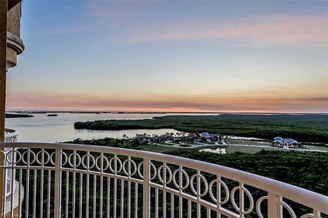 balcony at dusk with a water view