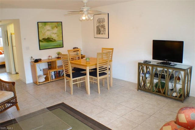 tiled dining space featuring ceiling fan