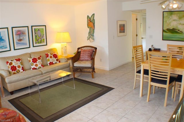 tiled living room with ceiling fan