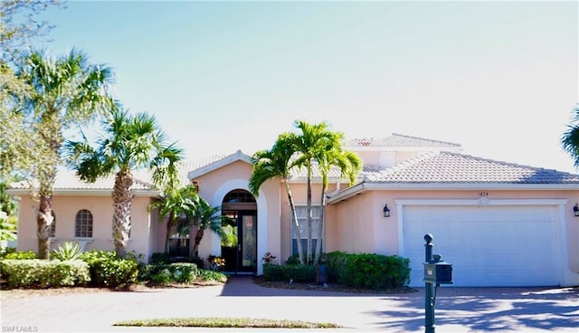 mediterranean / spanish house featuring a garage