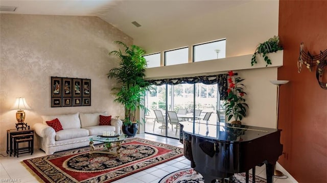 tiled living room with high vaulted ceiling