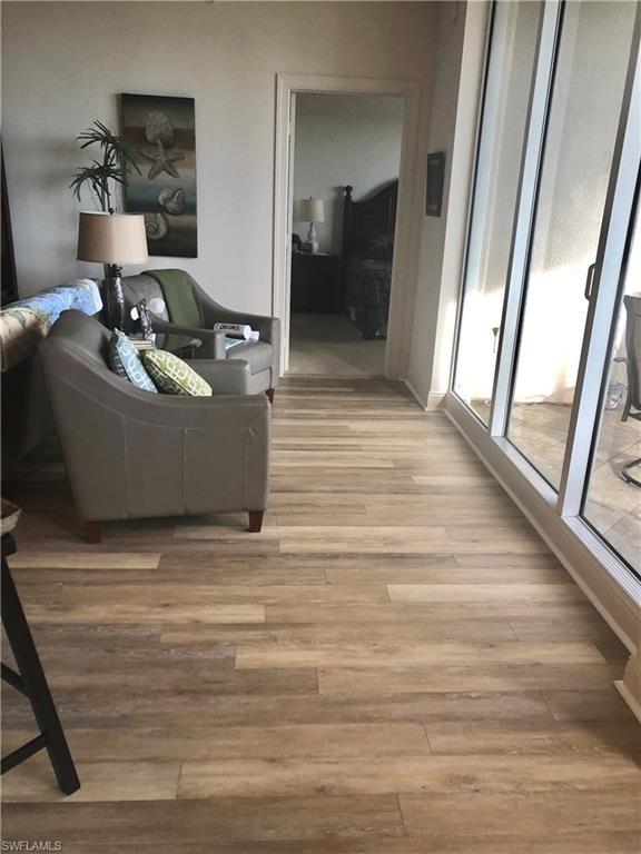 living room with light hardwood / wood-style flooring