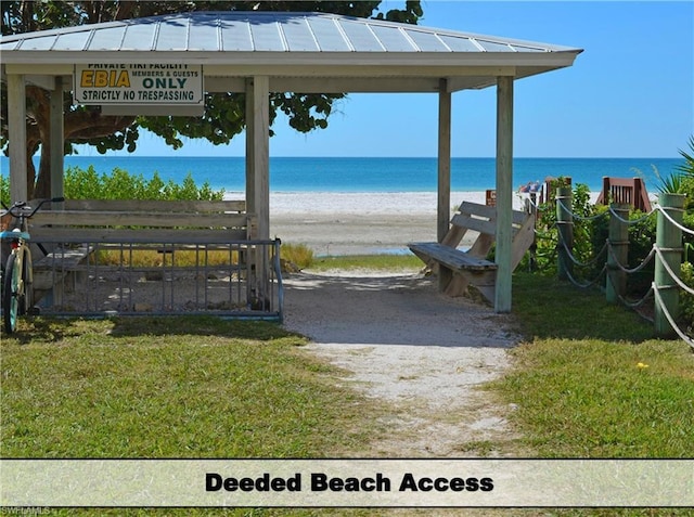 exterior space featuring a gazebo and a water view