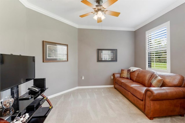 carpeted living room with ceiling fan and crown molding