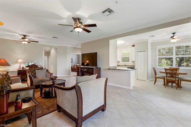 tiled living room with crown molding and ceiling fan