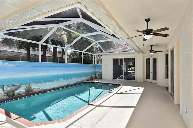 view of pool featuring a lanai, ceiling fan, and a patio area