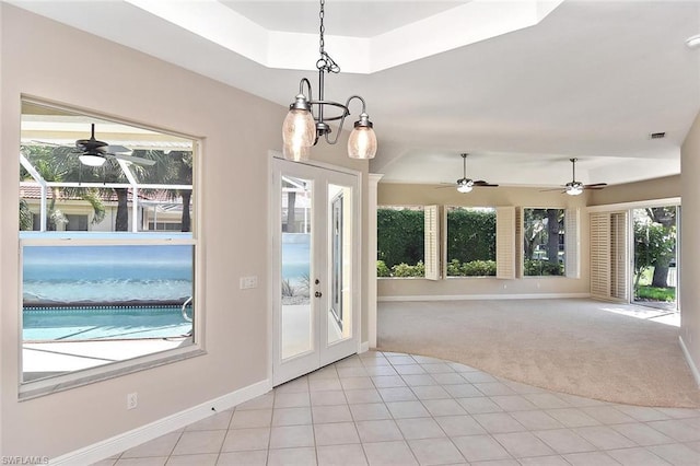 doorway to outside featuring plenty of natural light, french doors, and light tile flooring