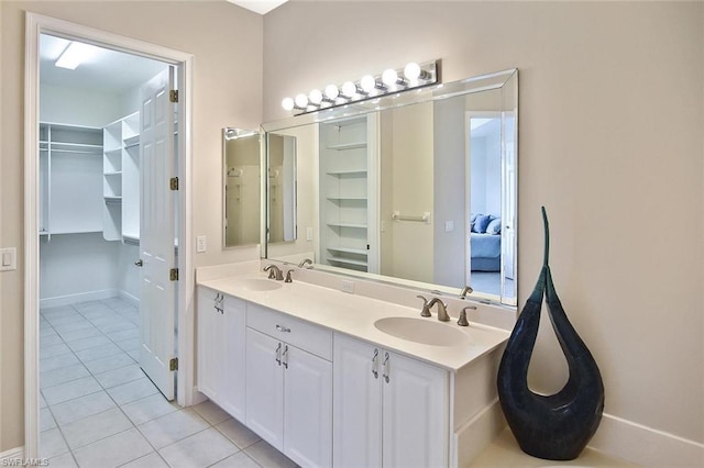 bathroom featuring tile floors, double sink, and large vanity