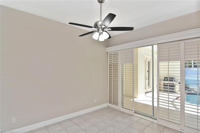 empty room with light tile flooring and ceiling fan