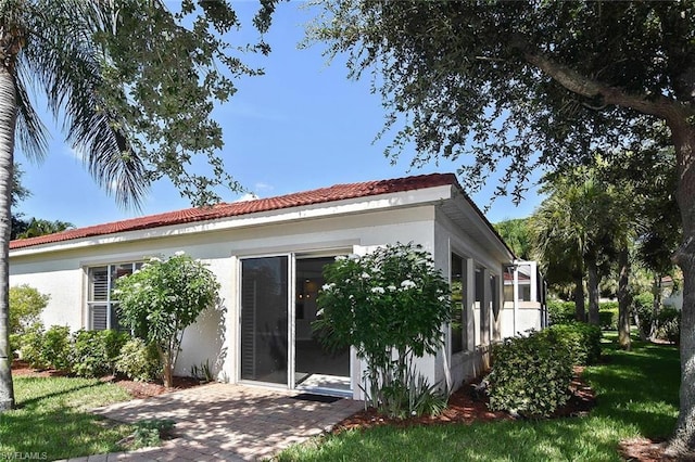 view of property exterior featuring a lawn