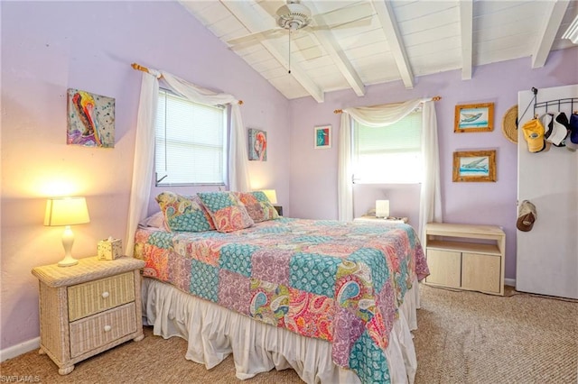 carpeted bedroom with vaulted ceiling with beams and ceiling fan