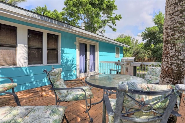 wooden deck with area for grilling