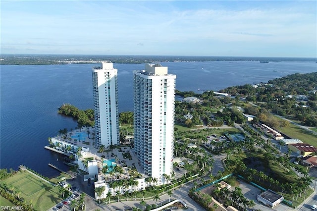 birds eye view of property with a water view