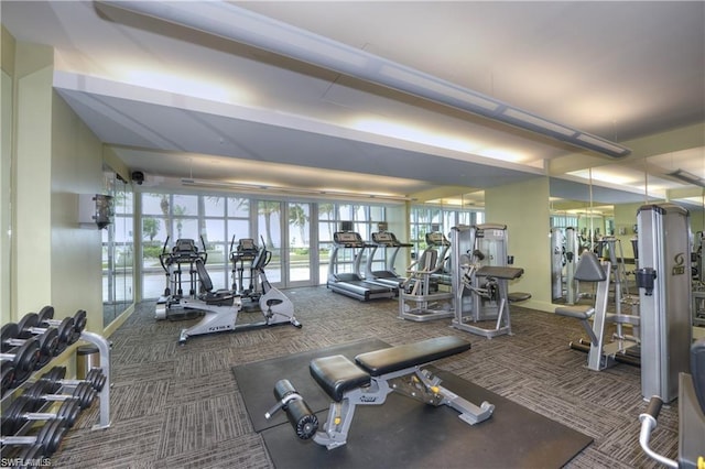 workout area with dark colored carpet