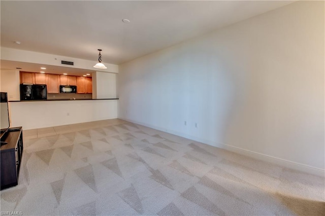 unfurnished living room with light carpet