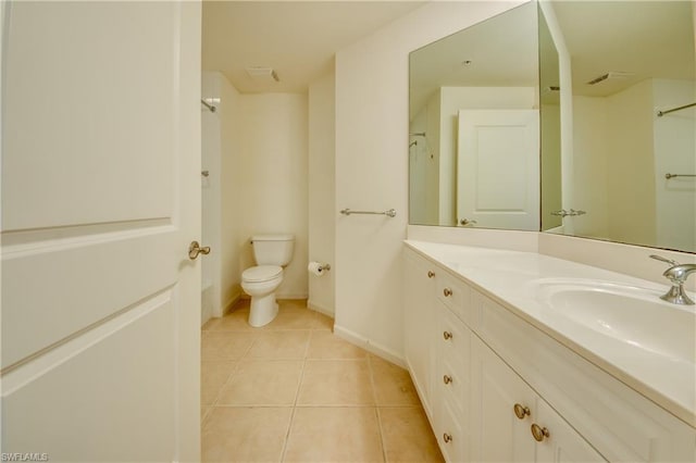 bathroom with vanity, tile flooring, and toilet