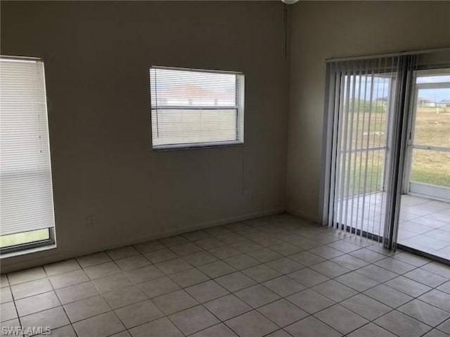 spare room featuring light tile floors