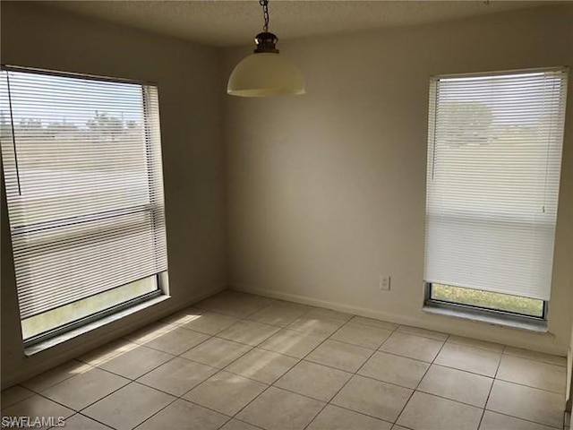 spare room with light tile flooring