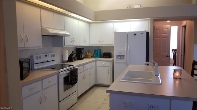 kitchen featuring white cabinetry, backsplash, light tile flooring, white appliances, and sink