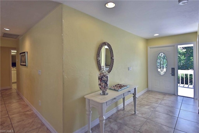 entrance foyer with light tile floors