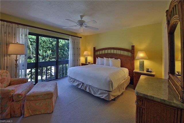 carpeted bedroom featuring ceiling fan and access to outside