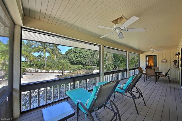 sunroom featuring plenty of natural light and ceiling fan